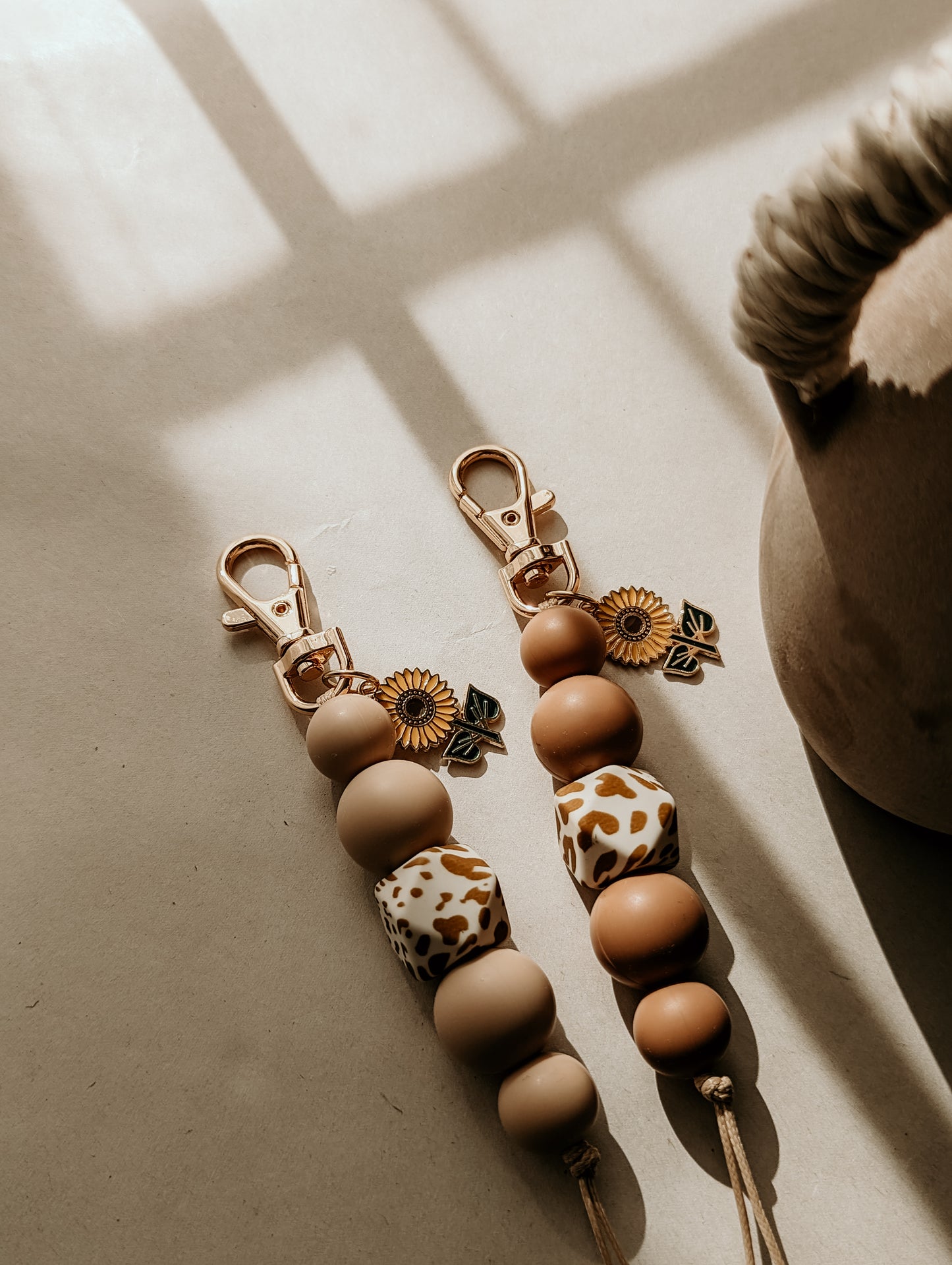 Sunflower charms with Cow Print Bead Keyrings