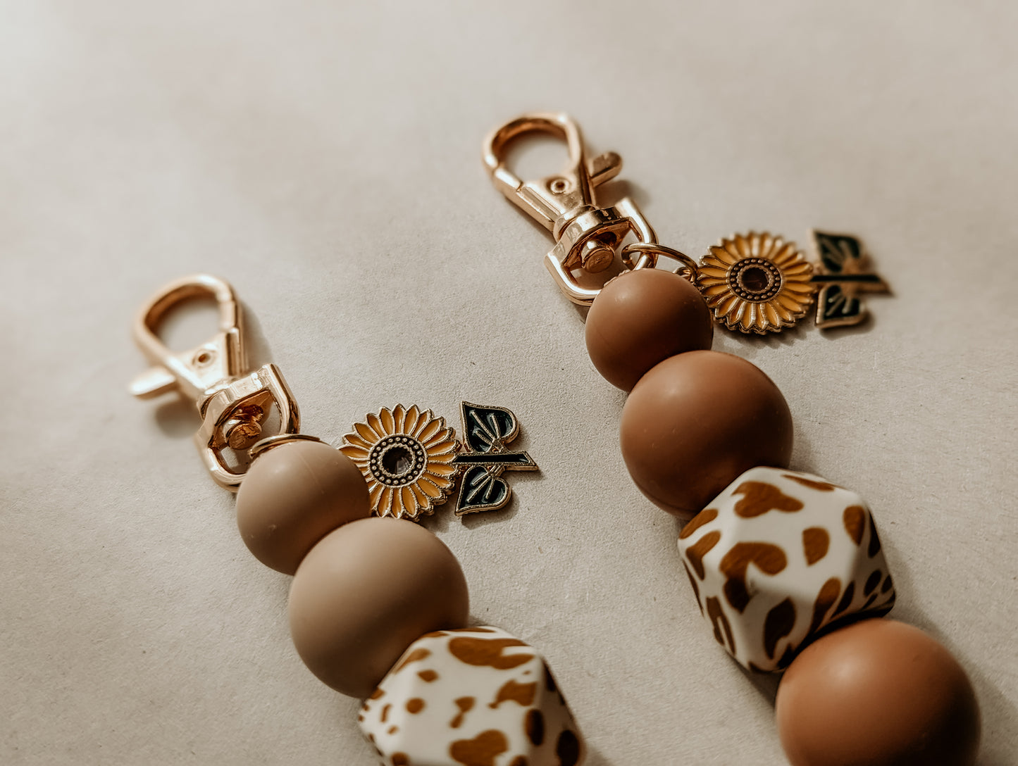 Sunflower charms with Cow Print Bead Keyrings