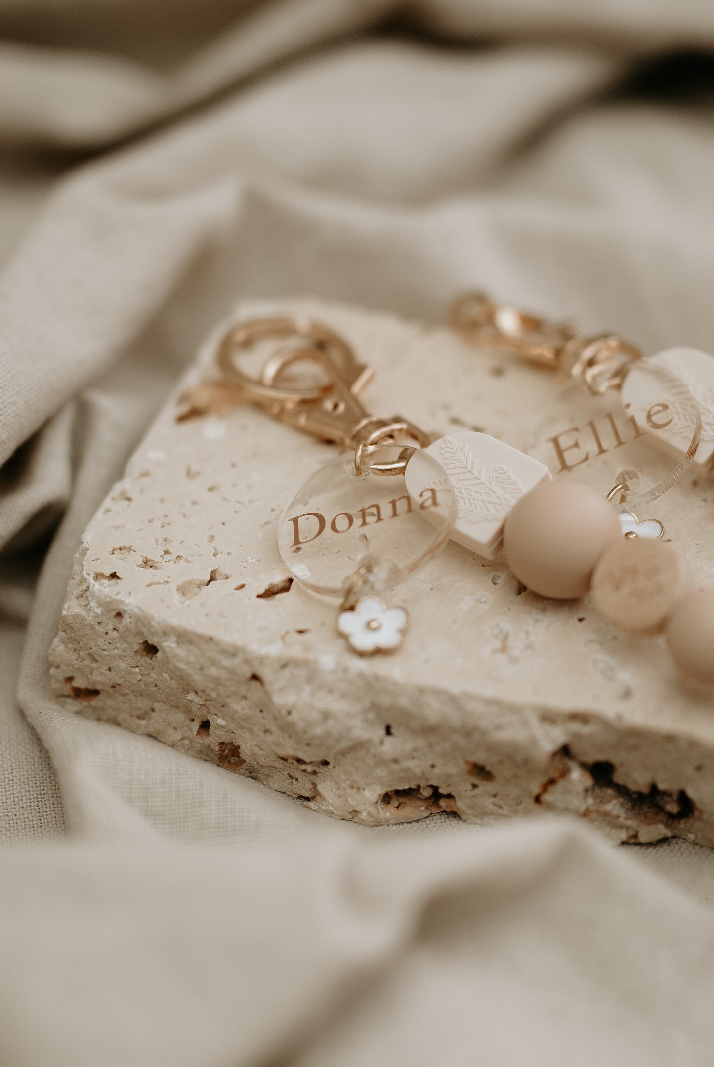 Personalised acrylic discs with white daisy charm